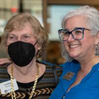 Susan Proctor poses for a photo with her arm around Loretta Konecki